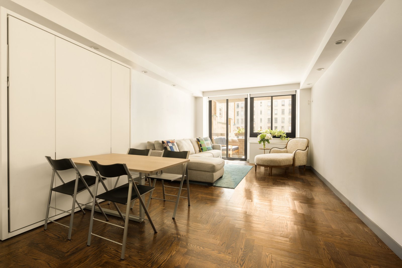 The dining table set before the south window