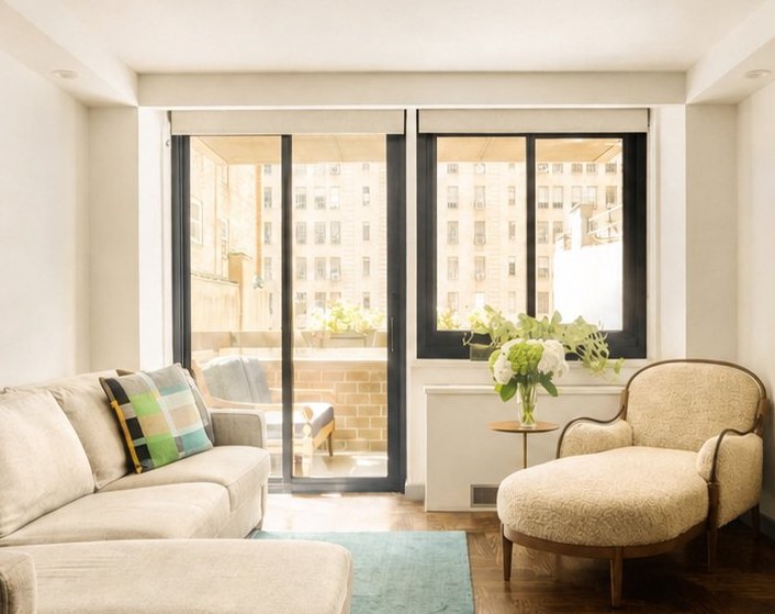 The sliding doors to the terrace, the reading chair beside them